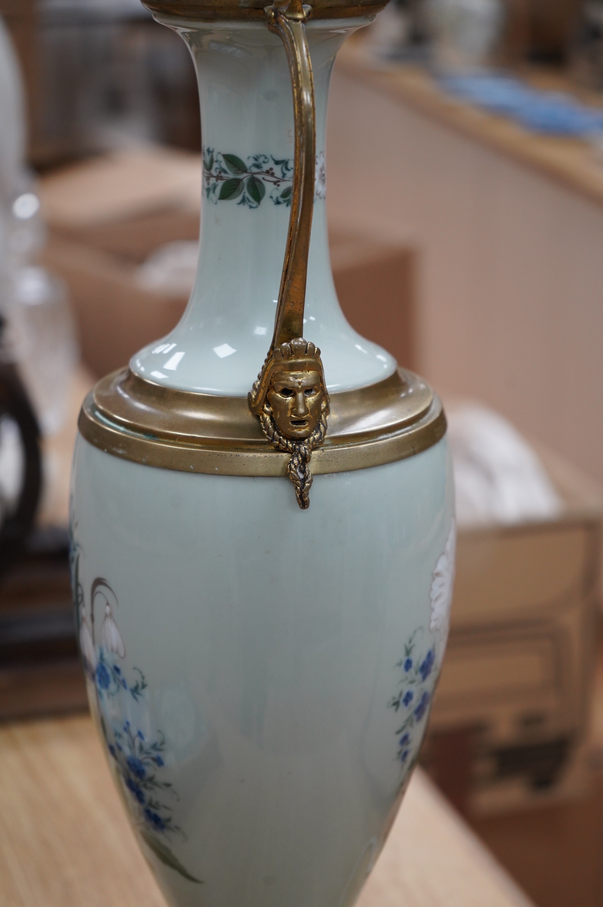 A late 19th century French celadon green glazed lamp, painted with flowers, fitted as a lamp, 56cm high overall. Condition - good